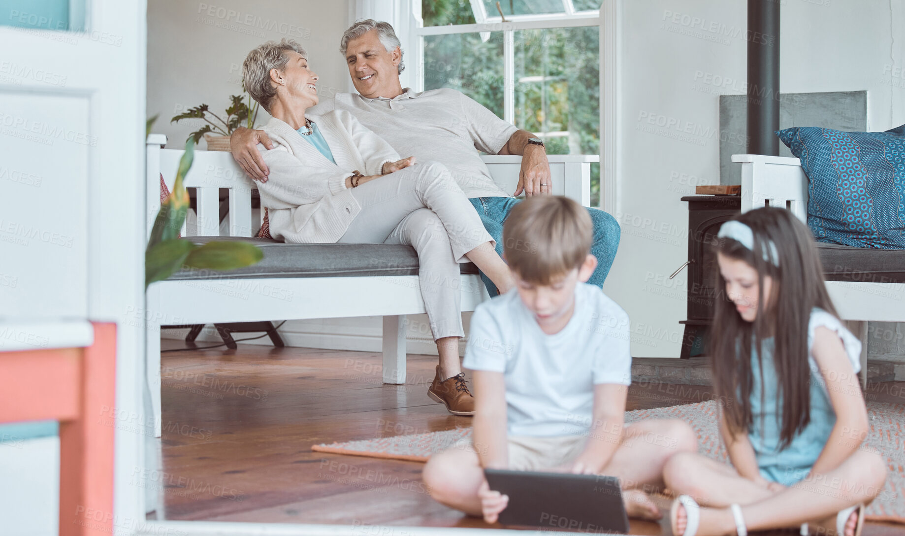 Buy stock photo Tablet, happy couple and grandparents relax with children in home for game or people learning. Grandmother, grandfather and siblings on technology in living room for streaming anime with generations