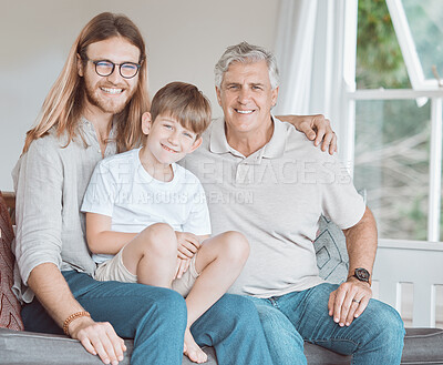 Buy stock photo Shot of a mature man bonding with his son and grandson at home
