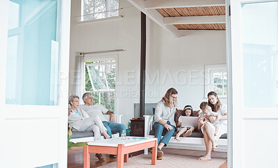 Buy stock photo Shot of a young family bonding together at home