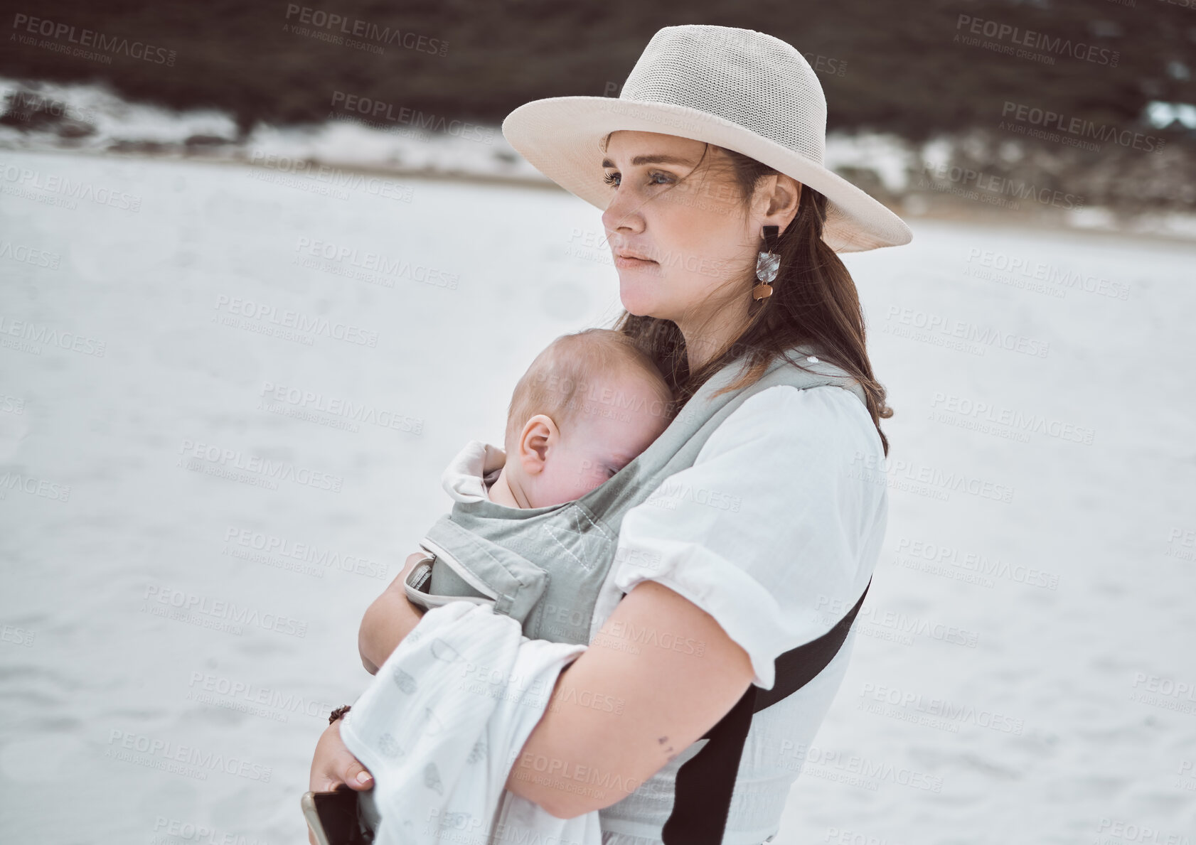 Buy stock photo Thinking, beach and mother with baby on vacation, holiday or getaway by coast for break. Dreaming, reflection and mom carrying infant child with memory by ocean for seaside weekend trip with travel.