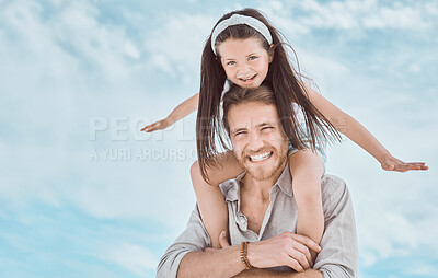 Buy stock photo Shot of a young father and daughter spending time together at the beach