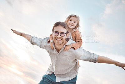 Buy stock photo Shot of a man spending and his daughter spending time together at the beach