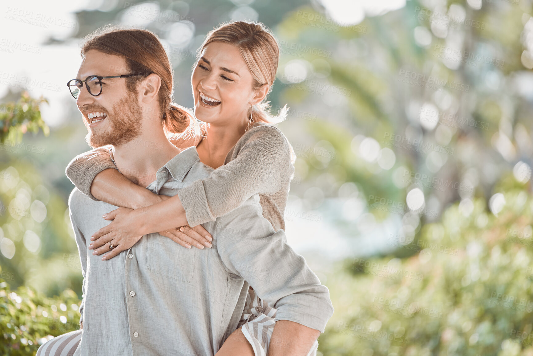 Buy stock photo Couple, smile and piggy back in garden with game, bonding and playful outdoor in spring for connection. People, man and woman with embrace, love and happy together in backyard for memory in Croatia