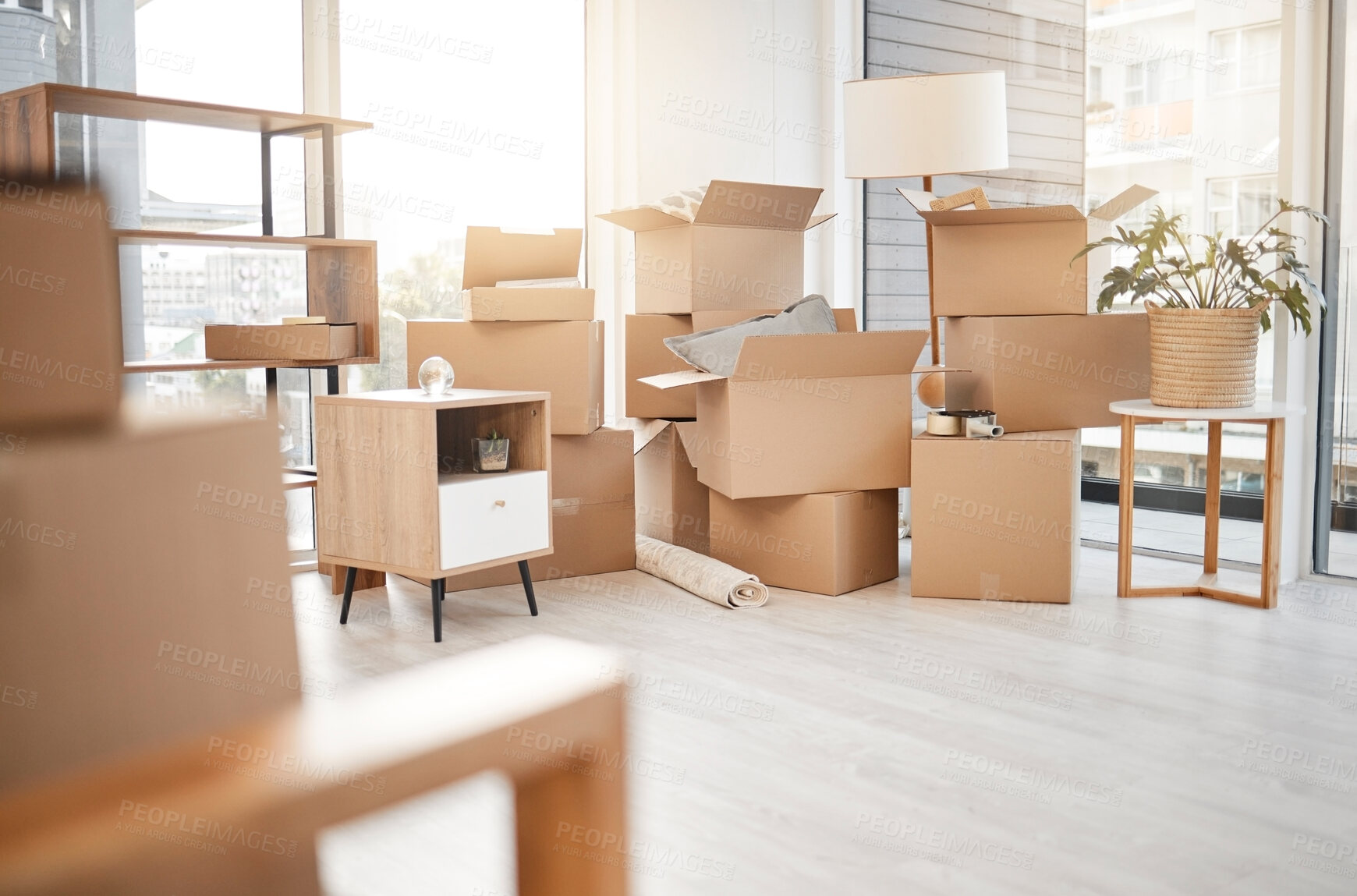 Buy stock photo Moving, new home and cardboard boxes for packing house with furniture, living room decorations and apartment space. Household, packed box and empty property to rent, buy or own with modern interior
