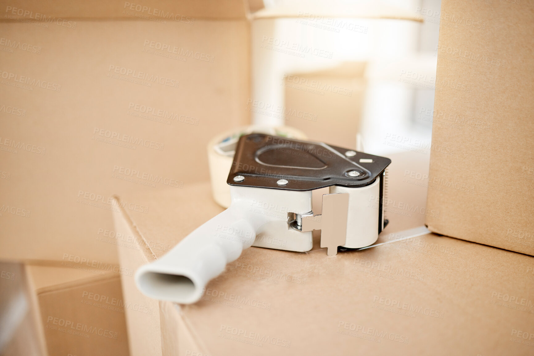 Buy stock photo Boxes, shipping or tape dispenser in home for moving, cardboard or package for real estate or property. Closeup, background or tool with adhesive, parcel and product with safety or packing in house