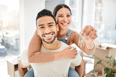 Buy stock photo Portrait of a young couple holding the keys to their new house