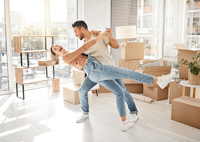 Buy stock photo Celebration, dance and couple with boxes, property and excited with rent apartment, mortgage and home. Cardboard, man and woman dancing, real estate and moving with love, quality time and romance