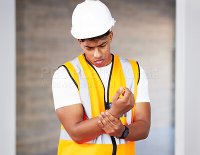 Buy stock photo Accident, building and wrist pain with construction worker man on site for maintenance or repair. Architecture, design or project management and engineer with emergency, fail or mistake for injury