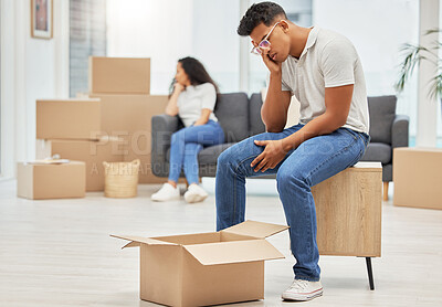 Buy stock photo Couple, unhappy and man worry with box for moving stress, lost items and overwhelmed with change of home. Woman, sofa and upset with partner for furniture placement, disagreement and miscommunication