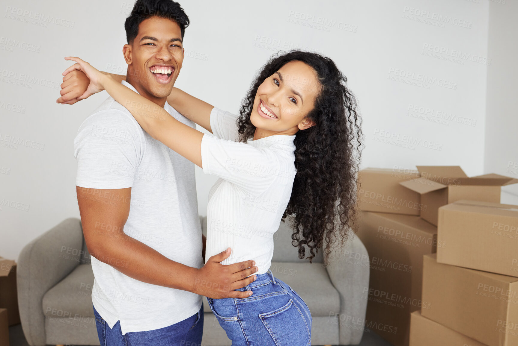 Buy stock photo Portrait, hug and happy couple moving in new home for real estate, mortgage and investment together. Embrace, woman and laughing man rent property, apartment and excited for relocation to dream house