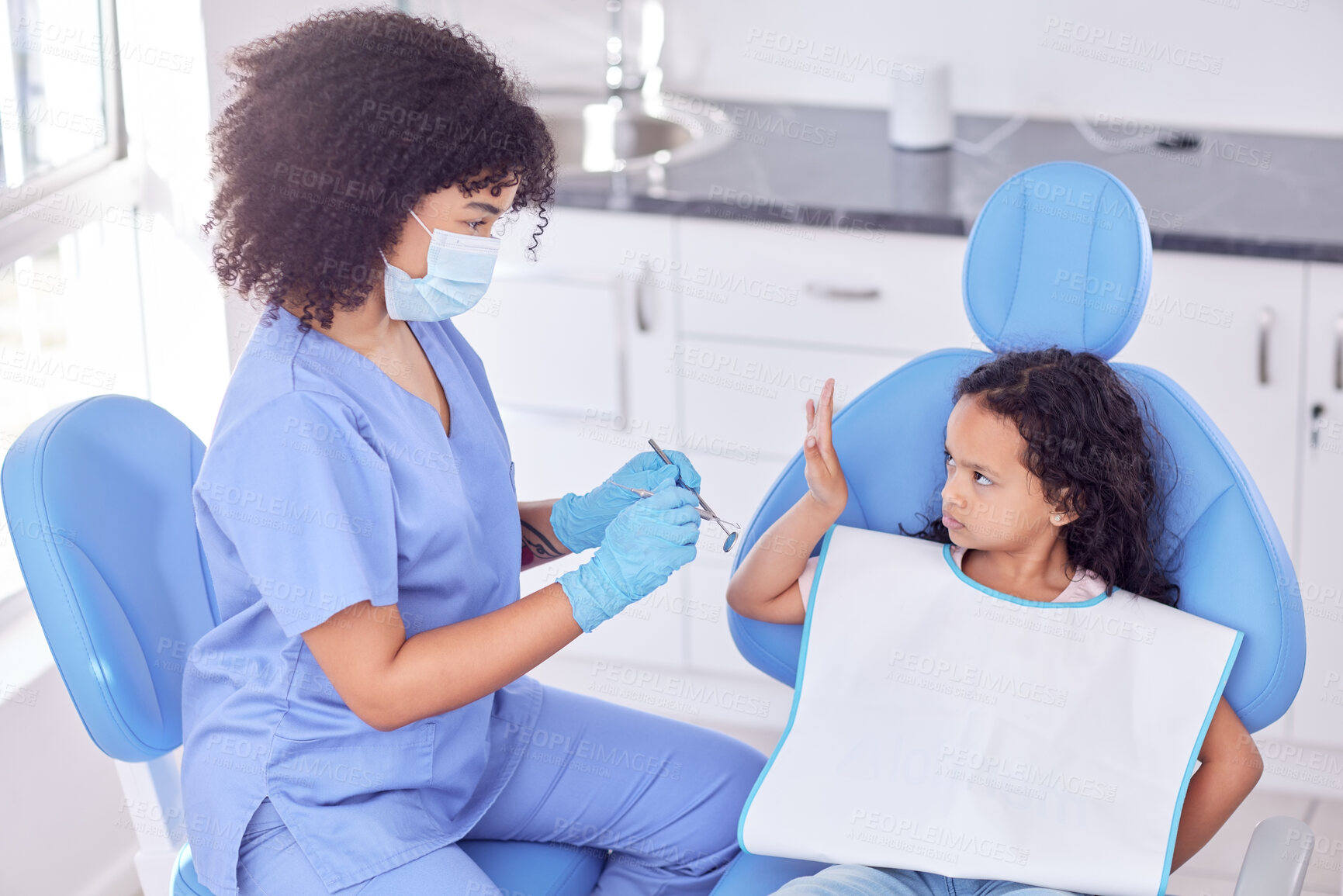 Buy stock photo Stop, scared and orthodontist with child patient for tooth extraction in clinic with consultation. Fear, dentistry and upset girl kid with pediatric dentist for cavity removal with equipment.