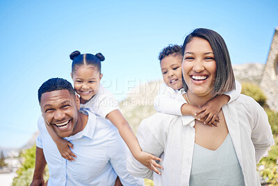 Buy stock photo Shot of a beautiful young family bonding outside