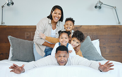 Buy stock photo Parents, children and pile on bed for portrait with comic game, smile and bonding in morning at family house. Father, mother and kids with piggy back, playful or happy together at apartment in Mexico