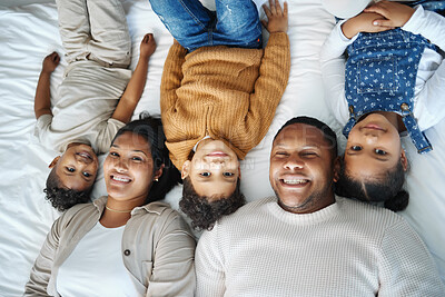 Buy stock photo Parents, children and above portrait on bed with smile, love or bonding for connection in morning at family house. Father, mother and kids with lying, excited or happy together at apartment in Mexico