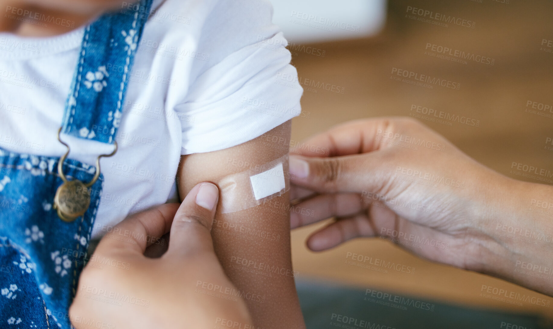 Buy stock photo Hands, pediatrician and arm of child with plaster for immunization shot, medication or injection. Healthcare, consultation and doctor with kid for medical vaccine treatment with patient in clinic.