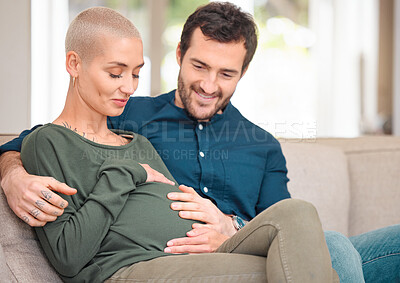 Buy stock photo Pregnancy, stomach and couple with love, home and bonding together with wellness in lounge. Apartment, pregnant woman and man with smile, care and happiness with maternity, relationship and tummy