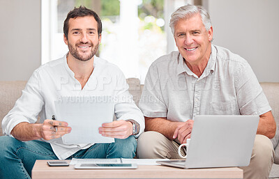 Buy stock photo Cropped portrait of a handsome young man helping his senior father with the household finances at home