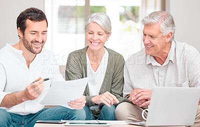 Buy stock photo Cropped shot of a handsome young male financial advisor helping a senior couple with their finances in their home