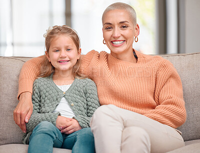 Buy stock photo Portrait of a daughter and mother bonding on the sofa together at home
