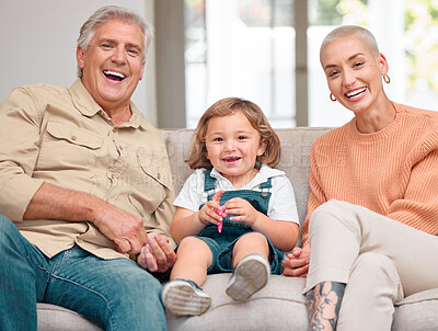 Buy stock photo Portrait of a mature man bonding with her daughter and grandson on the sofa at home