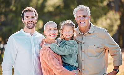 Buy stock photo Shot of a multi-generational family posing together outdoors