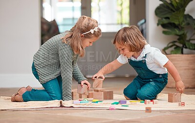 Buy stock photo Playing, children and wooden blocks in house, fun and bonding of family, growth and development in lounge. Games, kids and learning with toys, siblings and together in living room, floor and home