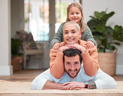 Buy stock photo Parents, girl and happy with piggyback on floor at home for bonding, fun and support in Canada. Family, people and kid on portrait in living room for care, playful and relax on break with smile