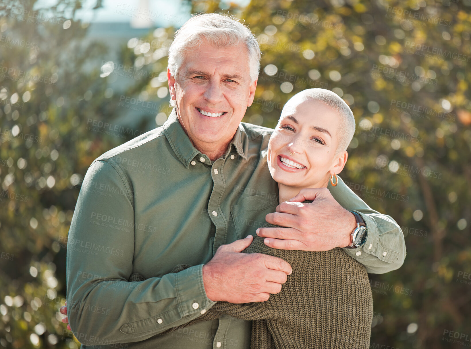 Buy stock photo Cropped portrait of an attractive young woman and her father outdoors