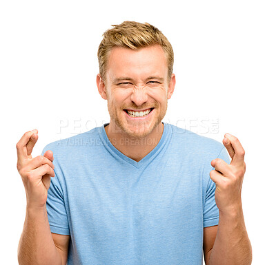 Buy stock photo Wish, fingers crossed and portrait of man in studio for winning, excited or hope for bonus. Emoji, luck and isolated person with hand sign for competition, good news and promotion on white background