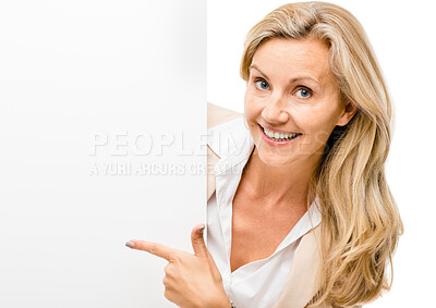 Buy stock photo Happy woman, portrait and pointing to billboard on mockup space for advertising isolated on a white studio background. Female person or employee with paper, sign or poster for banner or advertisement