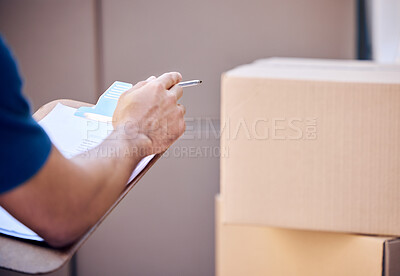 Buy stock photo Shot of a unrecognizable man using a clipboard while delivering outside
