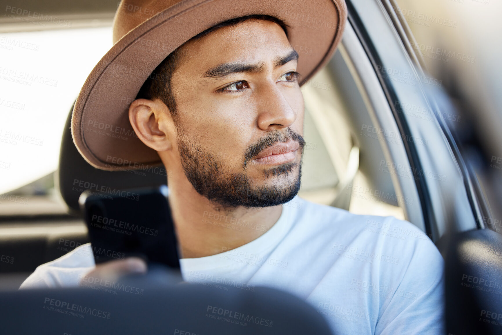 Buy stock photo Travel, thinking and man with phone in car for transportation, holiday and online guide on road trip. Serious, Mexican person and idea with tech in vehicle for location app, navigation or information