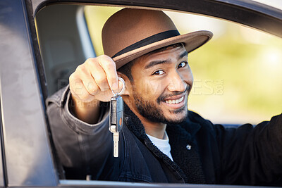 Buy stock photo Shot of a young man showing the keys to his car