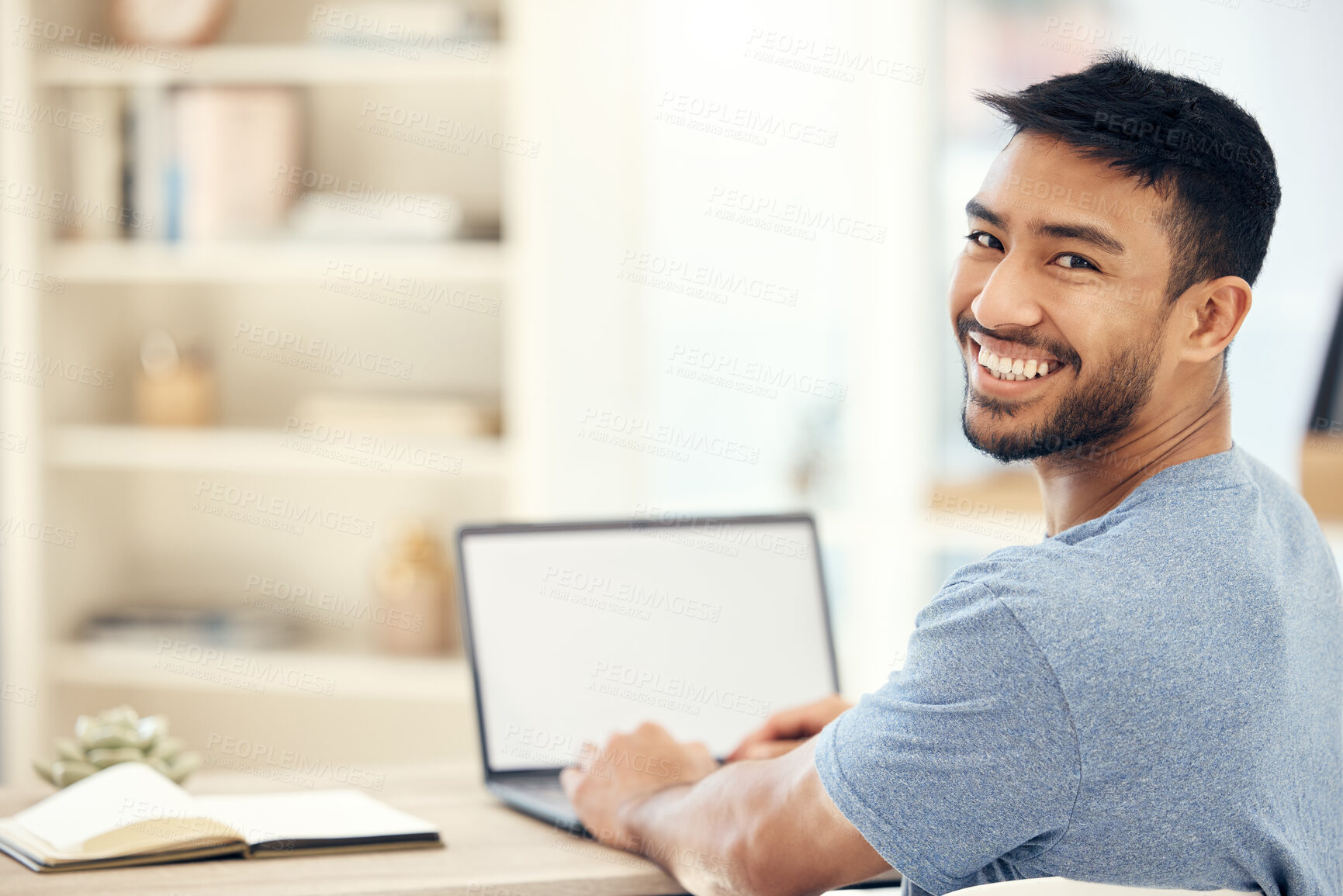 Buy stock photo Mockup, laptop screen and portrait of man in home with notebook with creative research for project. Smile, journalism and Asian freelance copywriter with blank computer for online article at house.