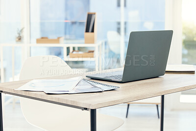 Buy stock photo Shot of an empty office with a laptop on the table