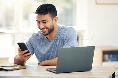Buy stock photo Shot of a young businessman using a phone in an office at work