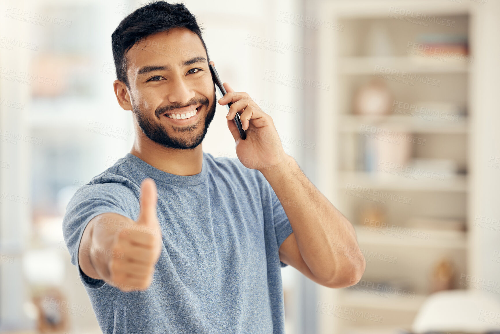 Buy stock photo Portrait, phone call and man with thumbs up in living room for communication, success or agreement. Contact, smile and person with hand gesture for achievement, conversation or loan approval in home