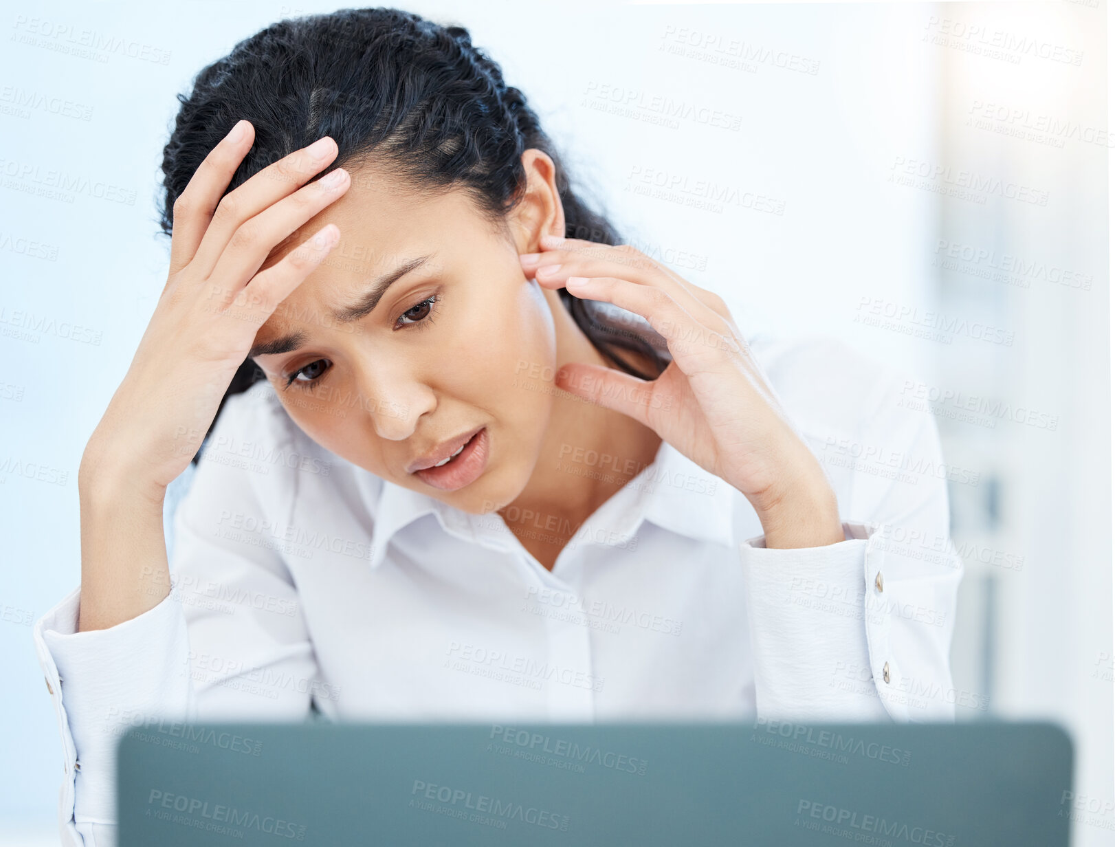 Buy stock photo Shot of a young businesswoman looking overwhelmed in an office at work