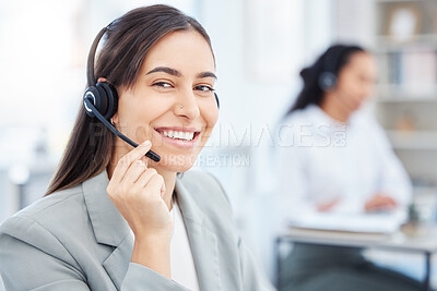 Buy stock photo Shot of a young female call center agent working in an office