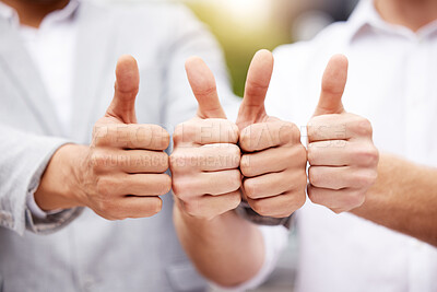 Buy stock photo Shot of two unrecognizable businesspeople showing a thumbs up outside