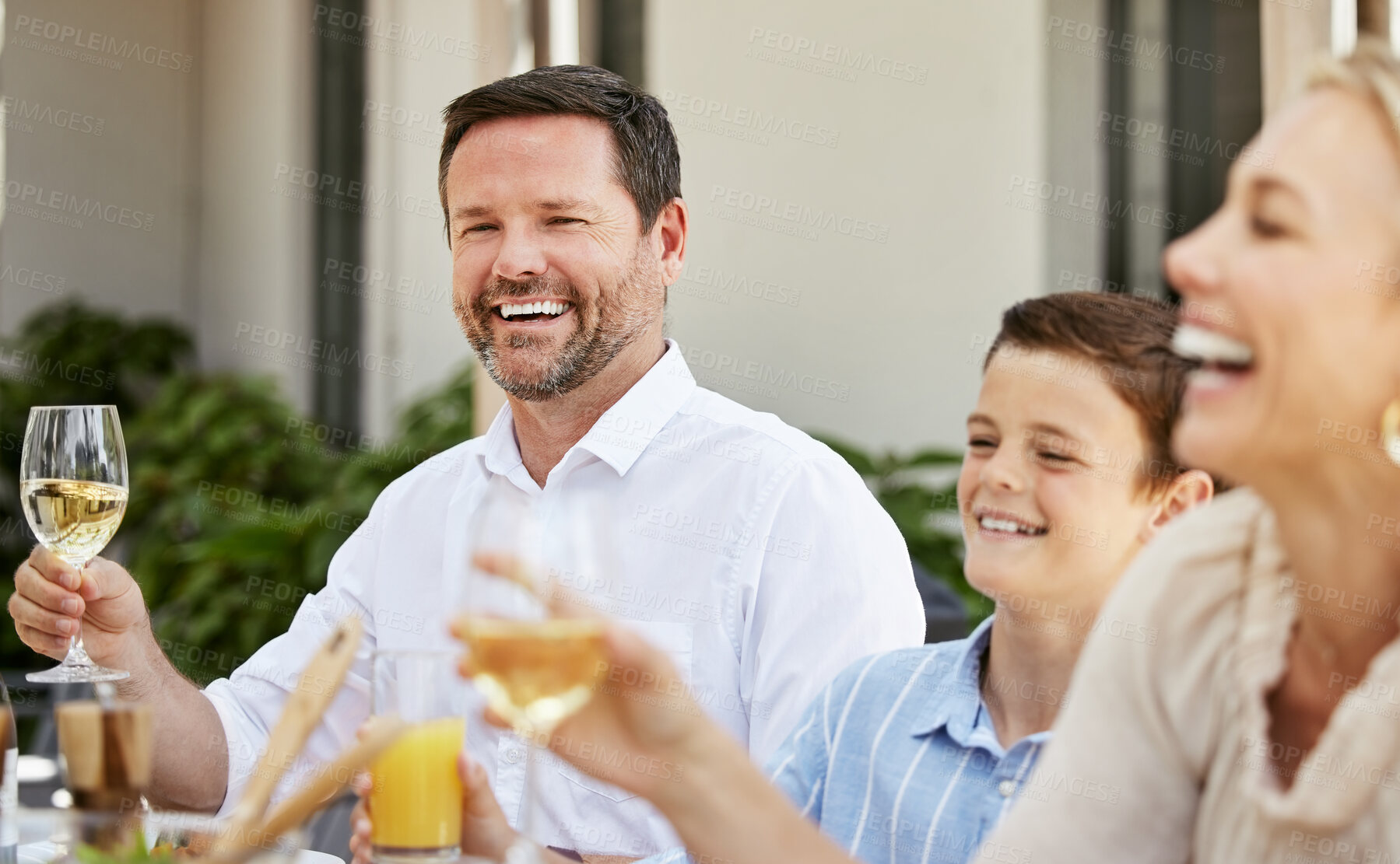 Buy stock photo Happy family, laughing and toast with champagne for meal, dining or thanks giving dinner by table. Dad, mom and child with smile for bonding, event or food together on holiday, weekend or lunch party