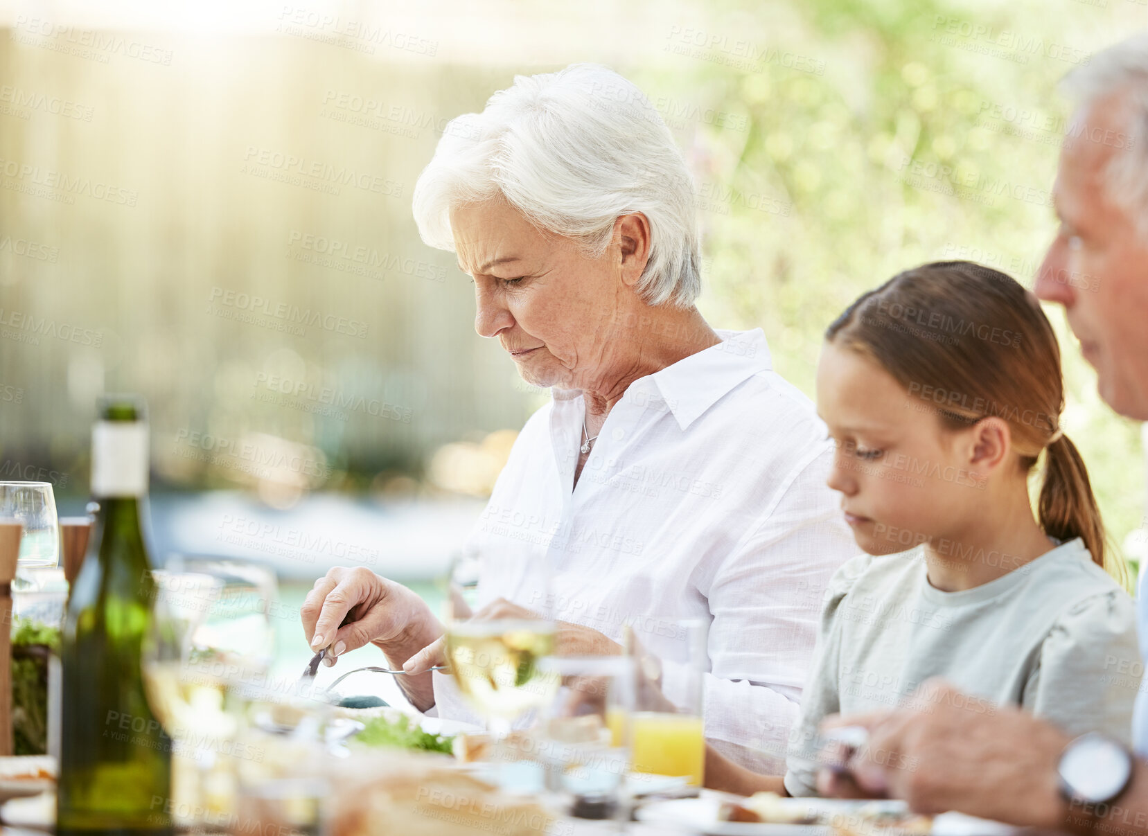 Buy stock photo Eating, event and food with family in garden for Thanksgiving celebration, festive holiday and brunch. Support, love and party with group of people and lunch for nutrition, grateful and tradition