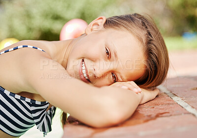 Buy stock photo Shot of an adorable little girl outside on a sunny day