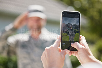 Buy stock photo Shot of a wife taking a picture of her husband outside