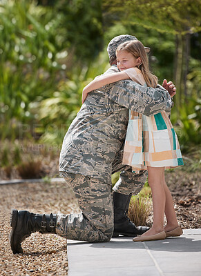 Buy stock photo Shot of a father returning from the army hugging his daughter outside