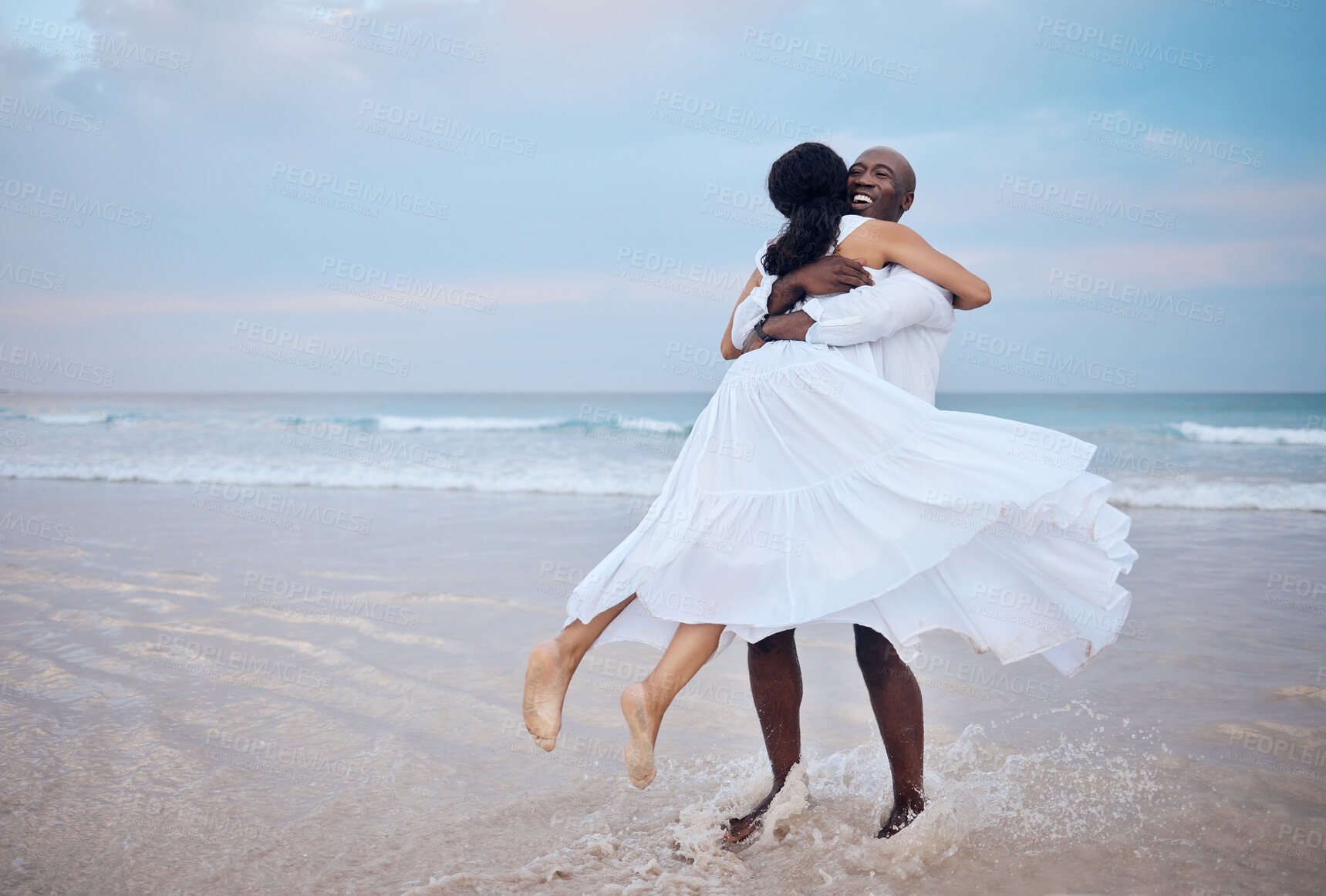 Buy stock photo Hug, honeymoon and black couple playing at beach for love, trust or travel together on date. Smile, sea or happy people romantic anniversary for holiday, loyalty or marriage commitment in Mauritius