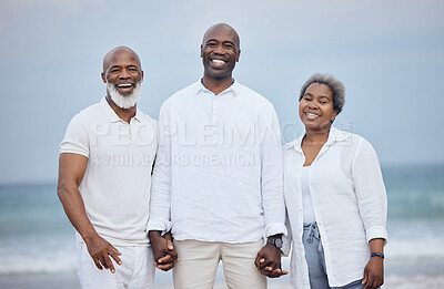 Buy stock photo Shot of a mature couple enjoying time with their son at the beach