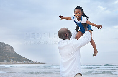 Buy stock photo Shot of a father and daughter bonding at the beach
