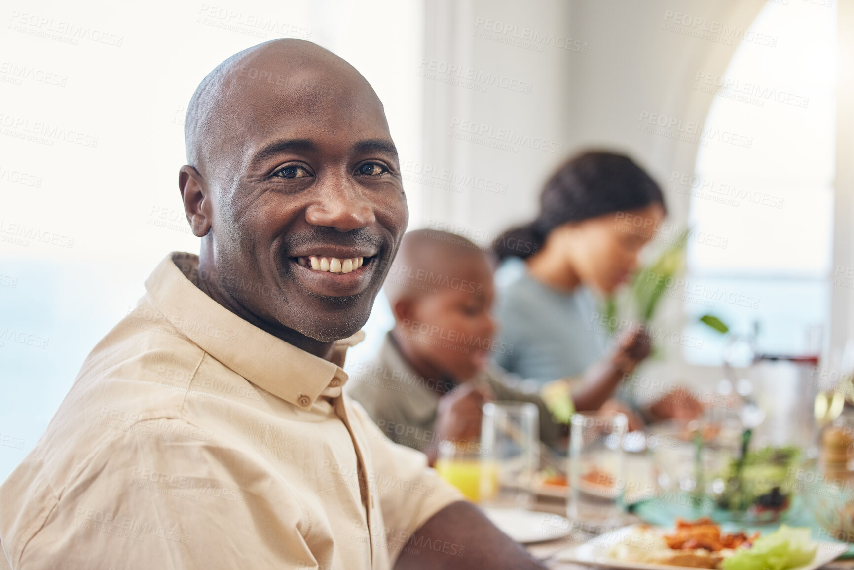 Buy stock photo Man, portrait and food with black family in home for Thanksgiving celebration, festive holiday and brunch. Support, love and party with people and lunch for nutrition, grateful and tradition