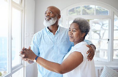 Buy stock photo Shot of a mature couple sharing a dance inside